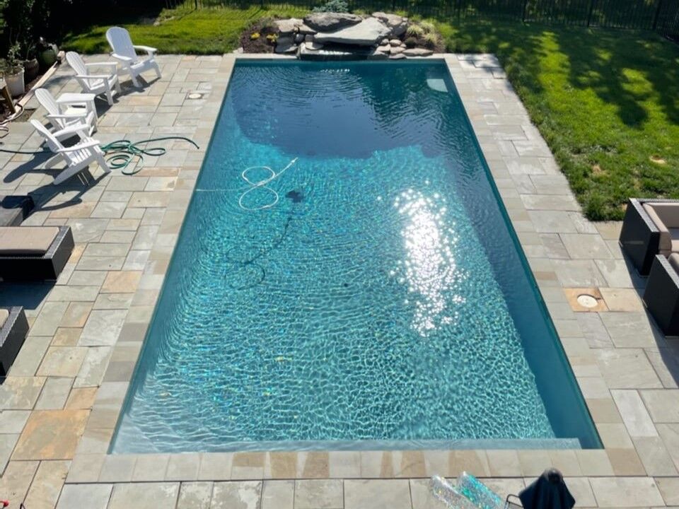 geometric-pool-with-boulders-waterfall