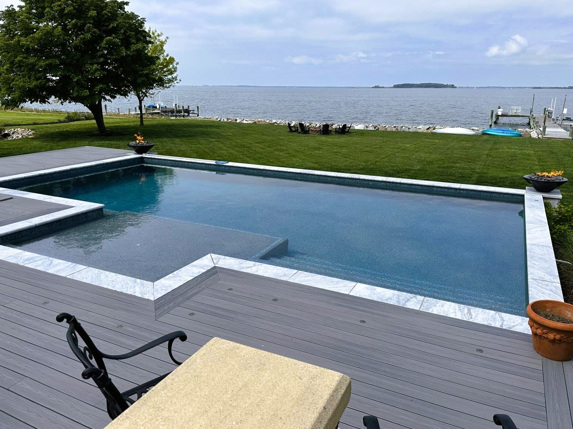 geometric-pool-with-tanning-ledge-and-fire-features