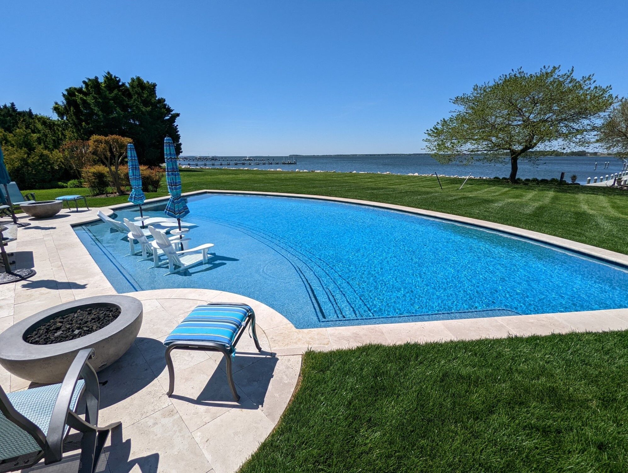 geometric-pool-with-tanning-ledge-and-fire-pits-1