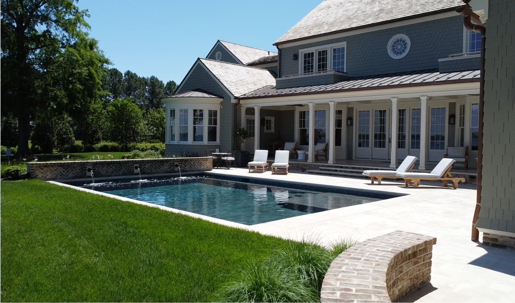 geometric pool with water features