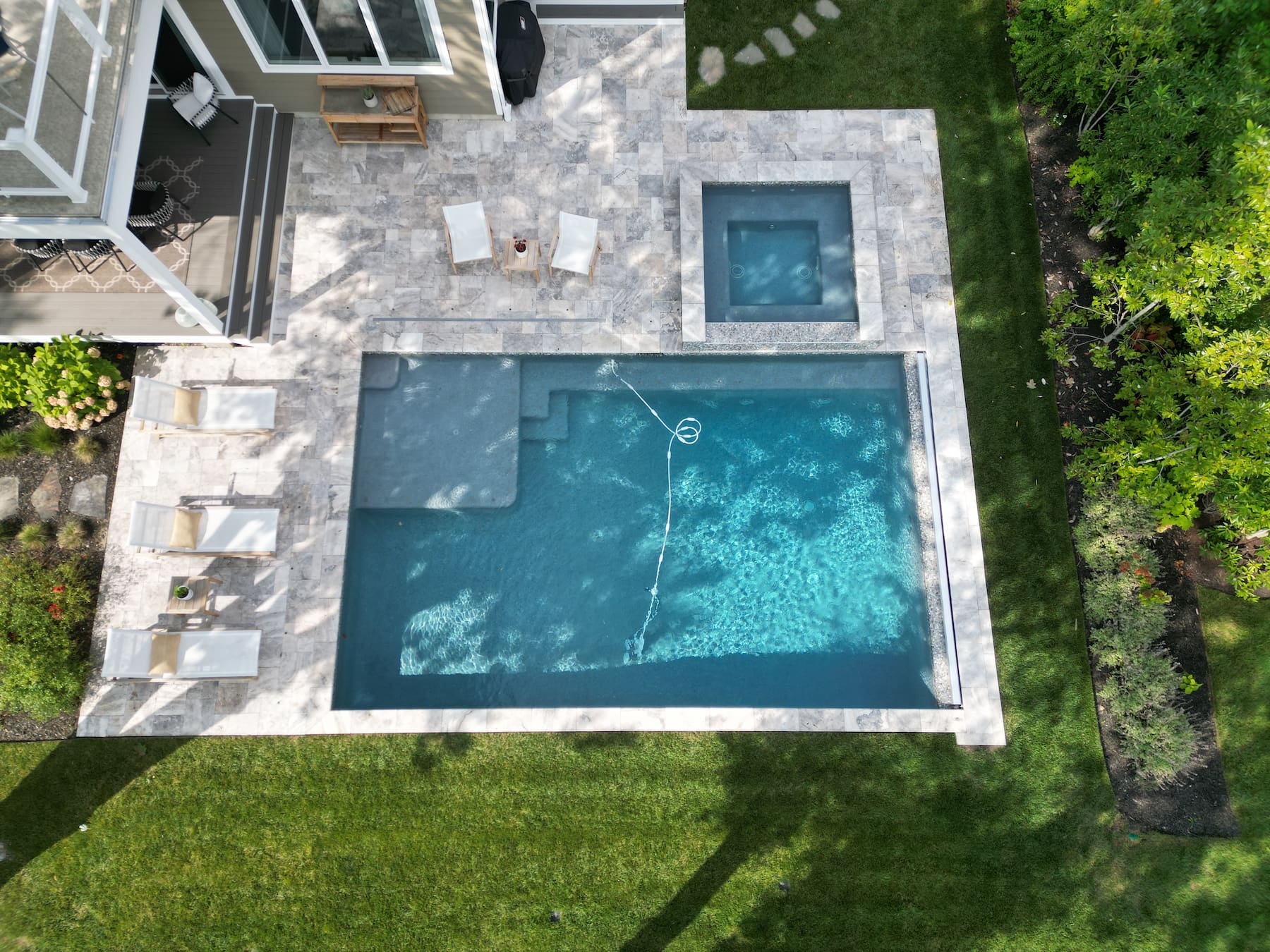 geometric pool with spa aerial view