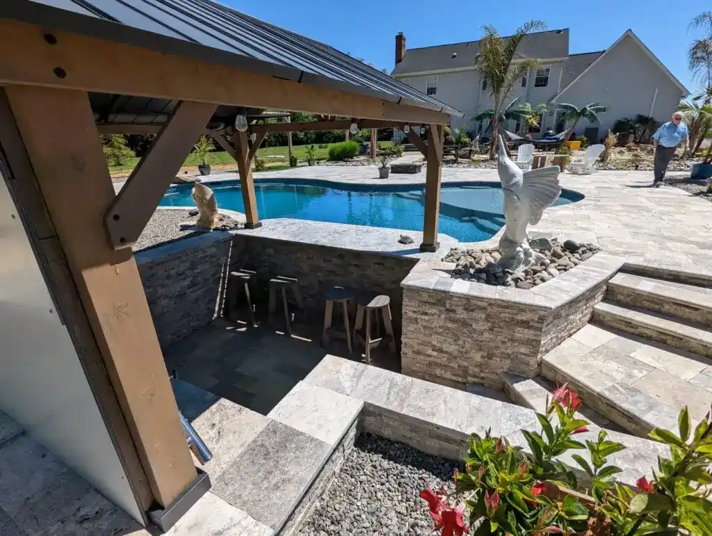 A custom sunken poolside bar by Coastal Pools in Maryland & Delaware