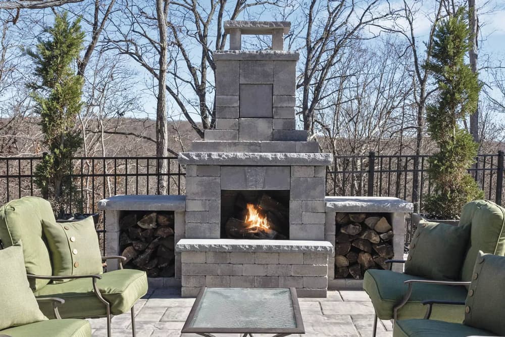 outdoor fireplace with wood storage