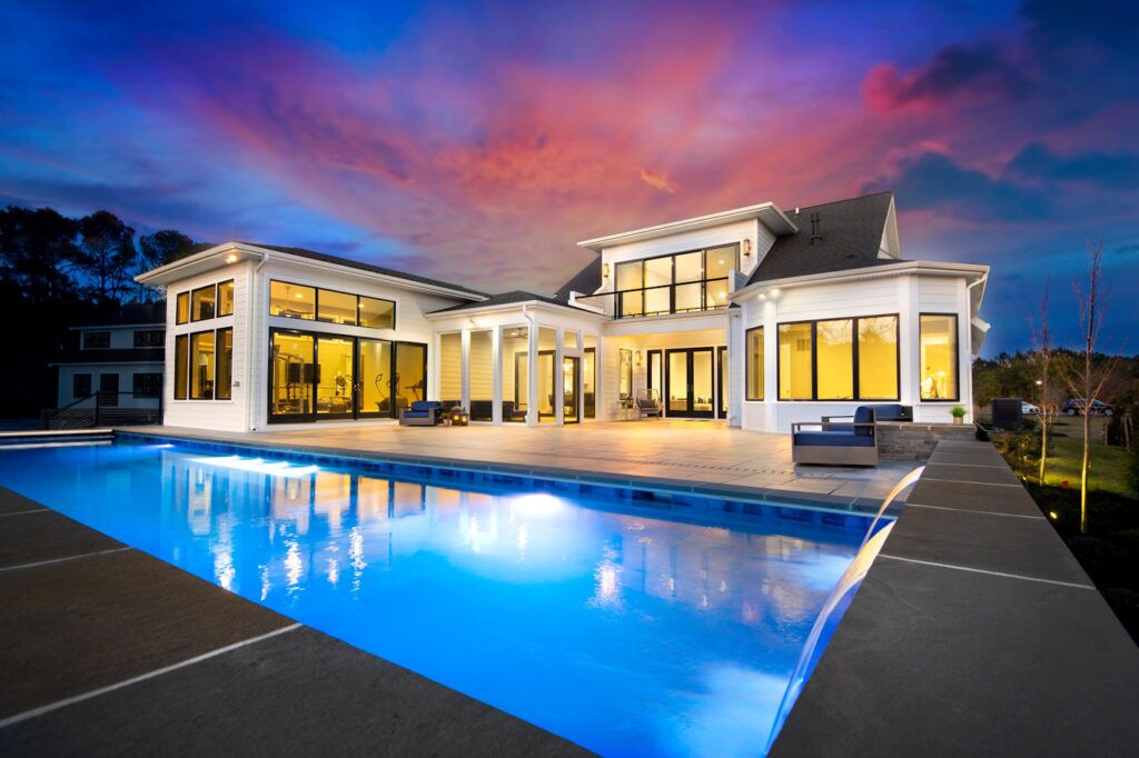 geometric pool with water features at sunset
