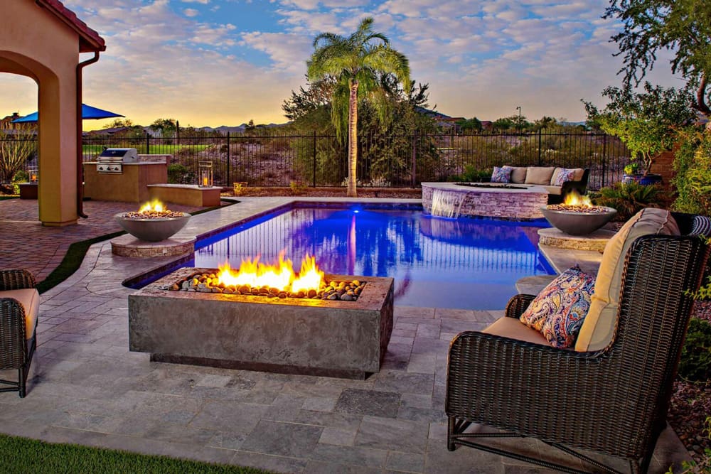 Fire table and fire feature next to pool