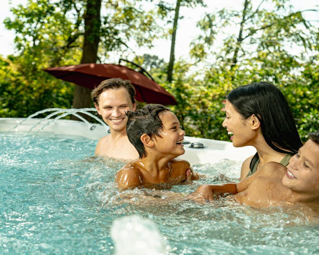 Family enjoying a swim in an outdoor hot tub