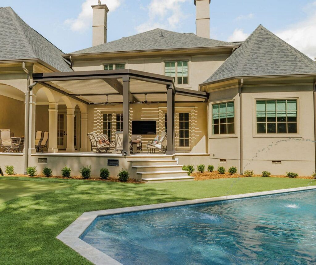 Luxury home with a pool and covered patio