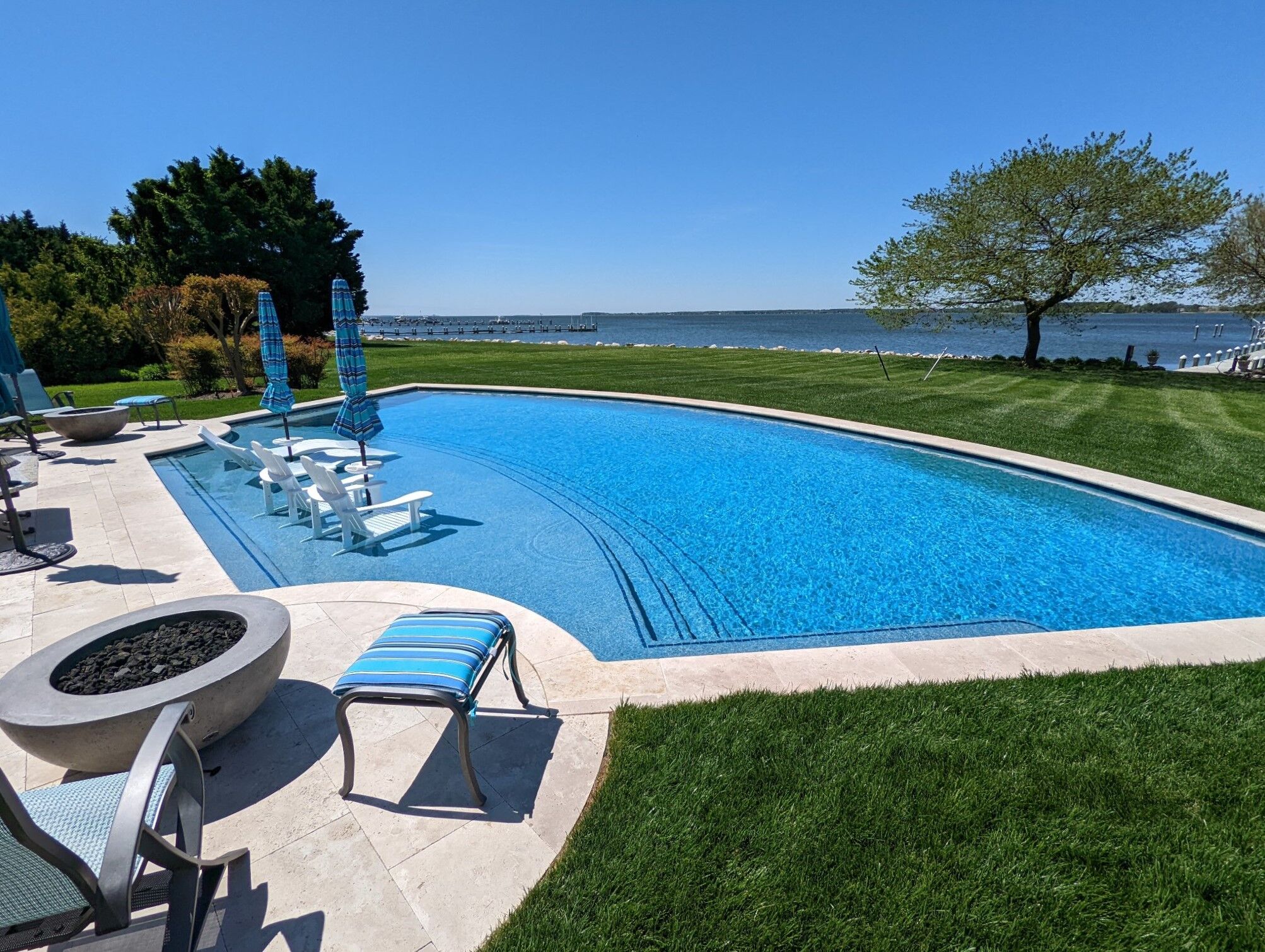 geometric-pool-with-tanning-ledge-and-fire-pits