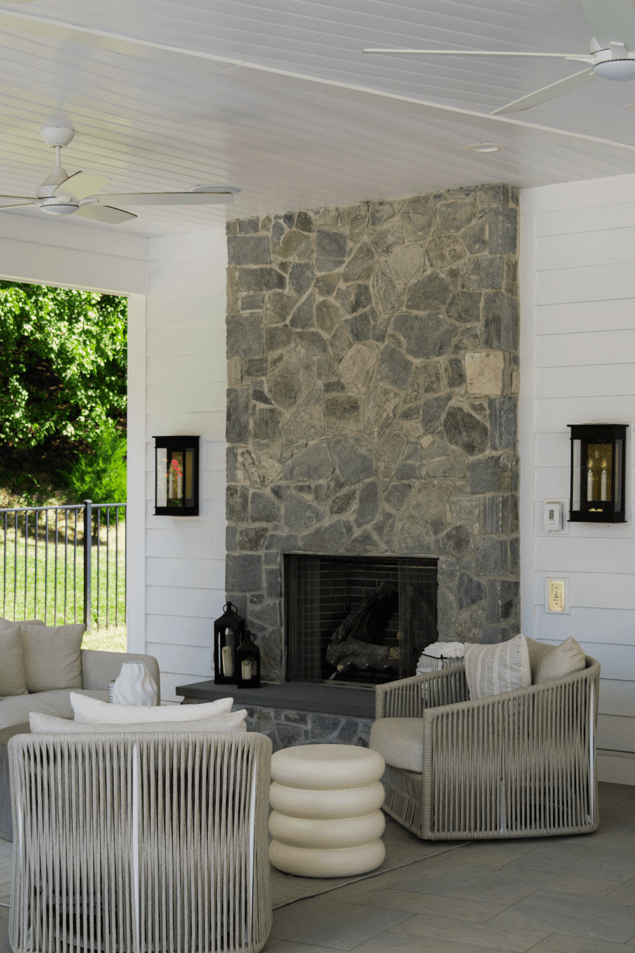 outdoor fireplace in covered seating area